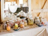 a sweets bar with colorful candies and popcorn is a cool idea for a fall bridal shower and won’t break the bank