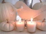 white pumpkins and candles are a chic and stylish decor idea for a neutral fall bridal shower
