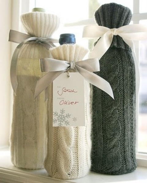 cozy up wine bottles using knit cover ups and ribbons and tags and give them as your wedding favors - this is a lovely idea for a winter wedding