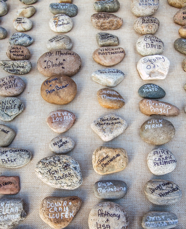 white burlap with various pebbles and rocks and names on them is a quick and natural DIY to try