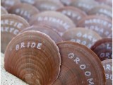 large seashells with names are a cool idea for a beach or coastal wedding