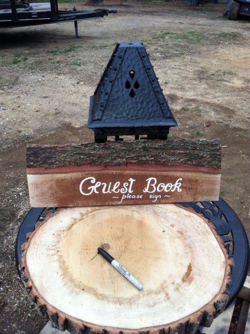 an oversized wood slice as a wedding guest book is a stylish idea that always works for a rustic wedding