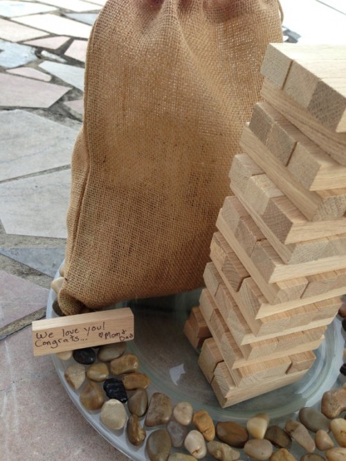 a stack of wooden slabs is a perfect wedding guest book for a fall rustic wedding