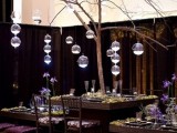 a large tree centerpiece with bubble candle holders and candles is a unique idea