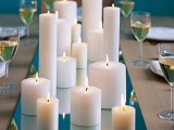 a mirror tray with pillar candles is an easy and budget-friendly wedding centerpiece