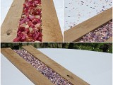 a wooden board with colorful flower petals is a budget-friendly and simple centerpiece idea