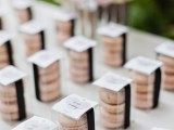 sheer boxes with pink macarons and with tags are elegant and delicious wedding favors
