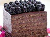 a chocolate cake topped with blackberries is a lovely and gorgeous wedding dessert to enjoy