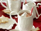 hot chocolate topped with marshmallows and candy canes is a lovely idea of a wedding dessert or just a hot drink to warm everyone up