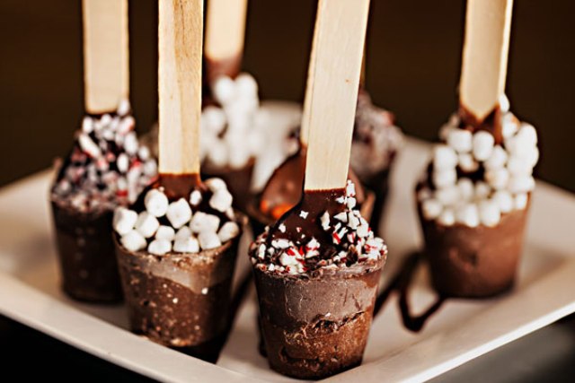 Hot chocolate popsicles on sticks, with marshmallows and peppermint bark are lovely Christmas or winter wedding desserts to enjoy