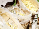 a cool popcorn bar is a timeless idea for a rustic wedding, serve various kinds with different spices and toppings