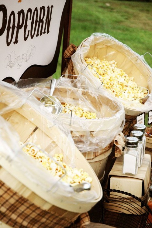 a cool popcorn bar is a timeless idea for a rustic wedding, serve various kinds with different spices and toppings