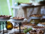 a fall wedding bar with fruit pies is a cool idea for a rustic or any other wedding, it will make guests happy