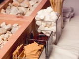 an s’mores bar is a timeless idea for a fall or winter wedding, it does not only cozy up the space but also helps people start a conversation