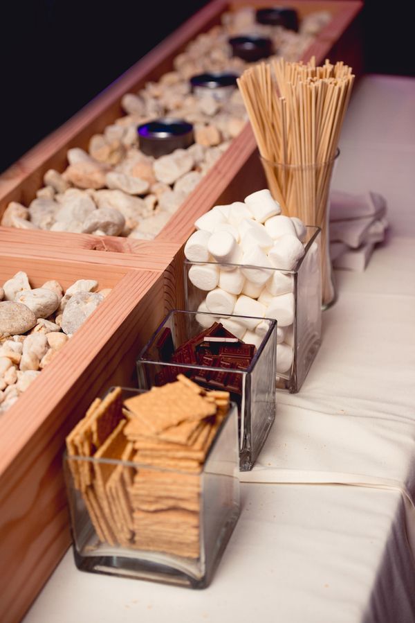 An s'mores bar is a timeless idea for a fall or winter wedding, it does not only cozy up the space but also helps people start a conversation