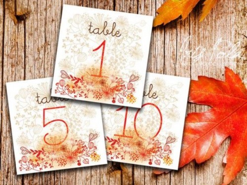 bright floral and leaf print fall table numbers will be a nice match for a fall wedding