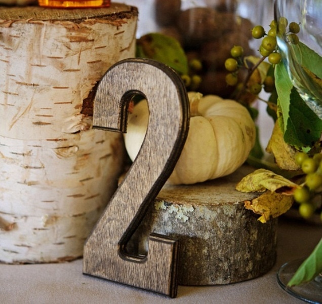 A plywood table number is a nice idea for a fall wedding centerpiece, you can pair it with pumpkins, greenery, stumps and other stuff