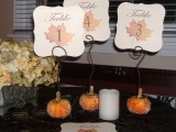 mini glitter pumpkins with wire and cutout cards with leaves and table numbers are very nice and cool decorations to rock