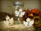 plywood leaves with numbers are nice items for a fall tablescape and will make your centerpiece catchier