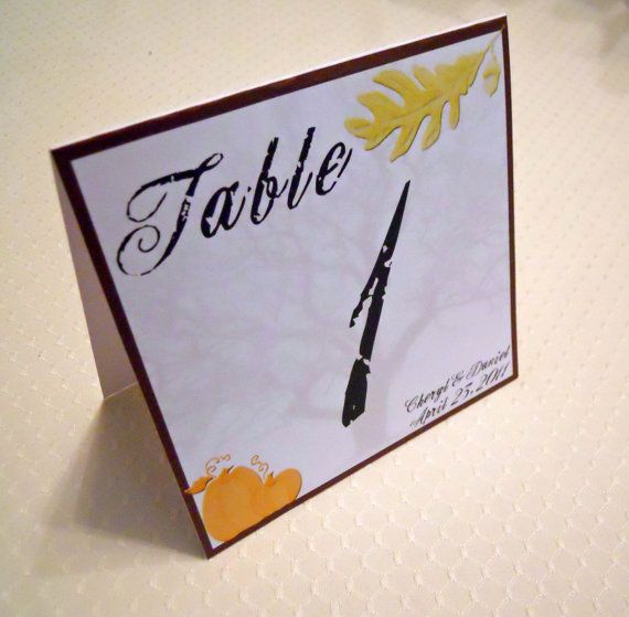 A printed table number with some leaves is a simple and cool item for a fall centerpiece