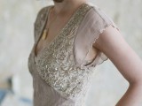 a delicate art deco blush wedding dress with silver embroidery and embellishments