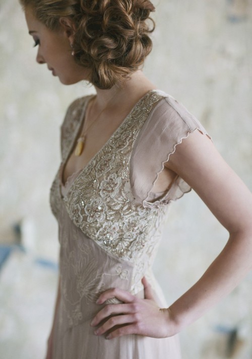 a delicate art deco blush wedding dress with silver embroidery and embellishments