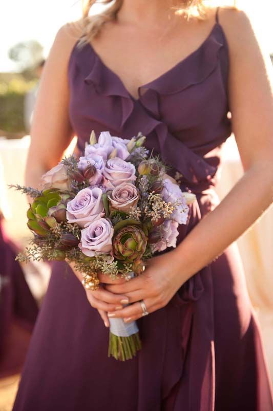 A wedding bouquet of mauve blooms, thistles and succulents is a beautiful and chic option