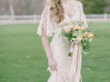 a beautiful peach and cream wedding bouquet with greenery and wildflowers is a refined and elegant idea