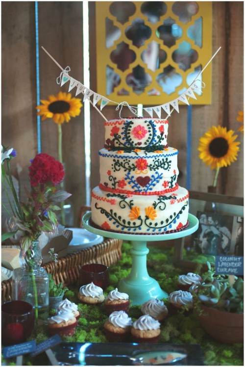 a bright ethnic pattern wedding cake in bold colors is a fun idea for a free-spirited weddings