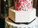 a bright wedding cake with a white geometric tier, a printed and a floral one for a whimsical wedding