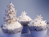 cupcakes with white icing, edible beads and even a mini Christmas tree on top will give your dessert table a fairy-tale feel