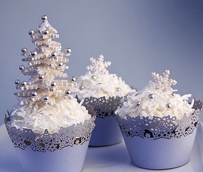 cupcakes with white icing, edible beads and even a mini Christmas tree on top will give your dessert table a fairy tale feel