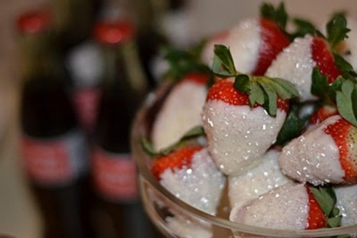 strawberries in white chocolate icing with sparkles are a romantic and cute dessert