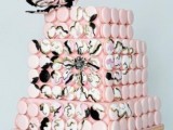 a unique square wedding cake made of macarons