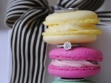 super colorful macarons with wedding bands stacked in between are a cool solution for a modern wedding with plenty of color