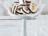 white meringue sandwiches with chocolate and nuts are adorable and really delicious desserts for a wedding