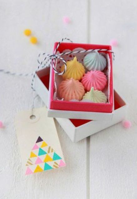a box with colorful meringue kisses is a lovely and delicious wedding favor, and it will match any wedding style