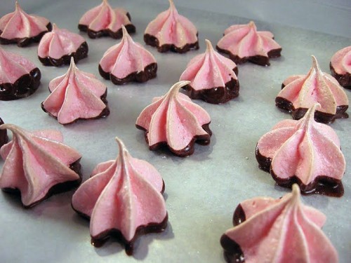 pink meringue kisses dipped into chocolate are delicious and easy wedding favors or desserts