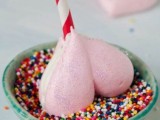 pink heart meringue on a stick dipped into colorful confetti is a very delicious and pretty dessert idea