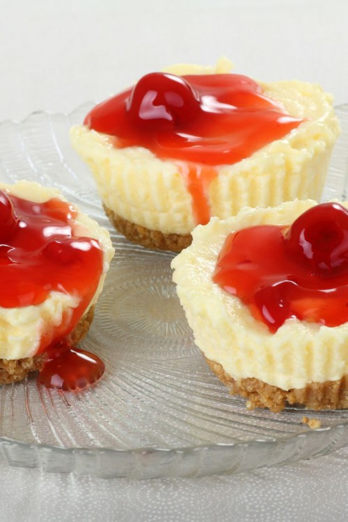 mini cheesecakes with cherry compote on top are amazing and very fresh and tasty