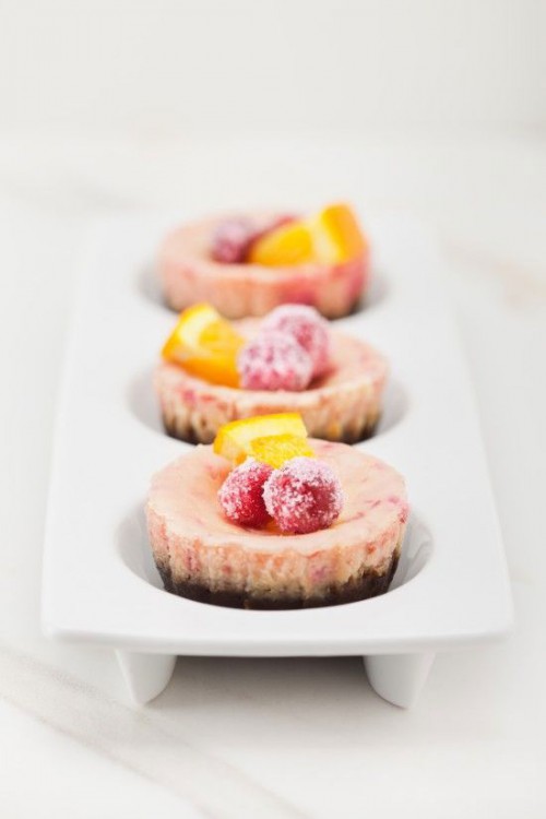 mini pink cheesecakes with sugared berries and citrus slices are amazing for a summer wedding