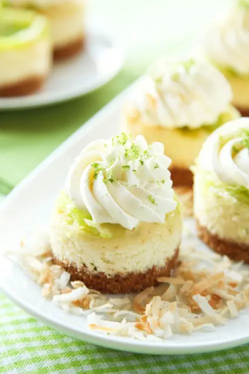 very refreshing lime mini cheesecakes with cream and some zest on top are delicious and very fresh