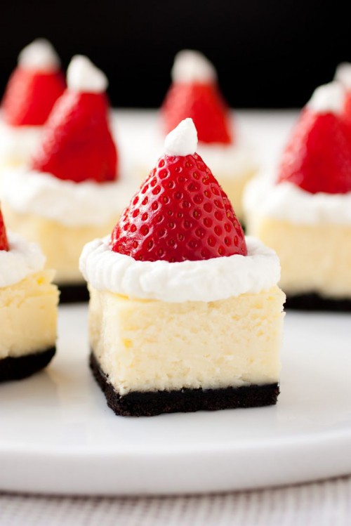 mini cheesecakes with chocolate bases and cream plus strawberries on top are amazingly tasty