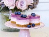 mini blueberry cheesecakes with fresh berries on top are amazing for any wedding and look cool and layered
