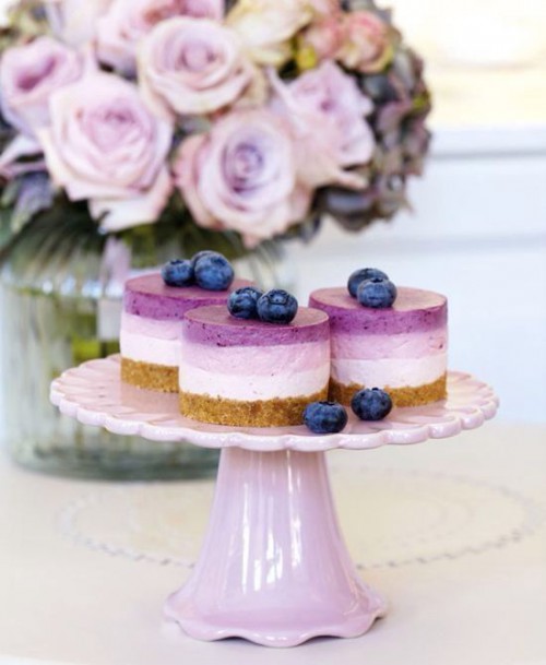 mini blueberry cheesecakes with fresh berries on top are amazing for any wedding and look cool and layered