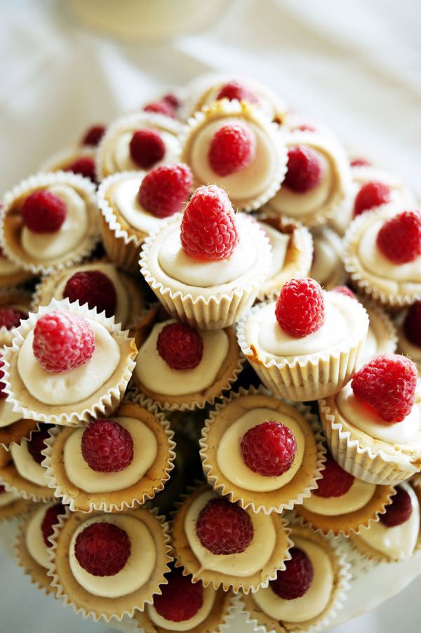 Mini raspberry cheesecakes with fresh berries on top are super cool and look super cute