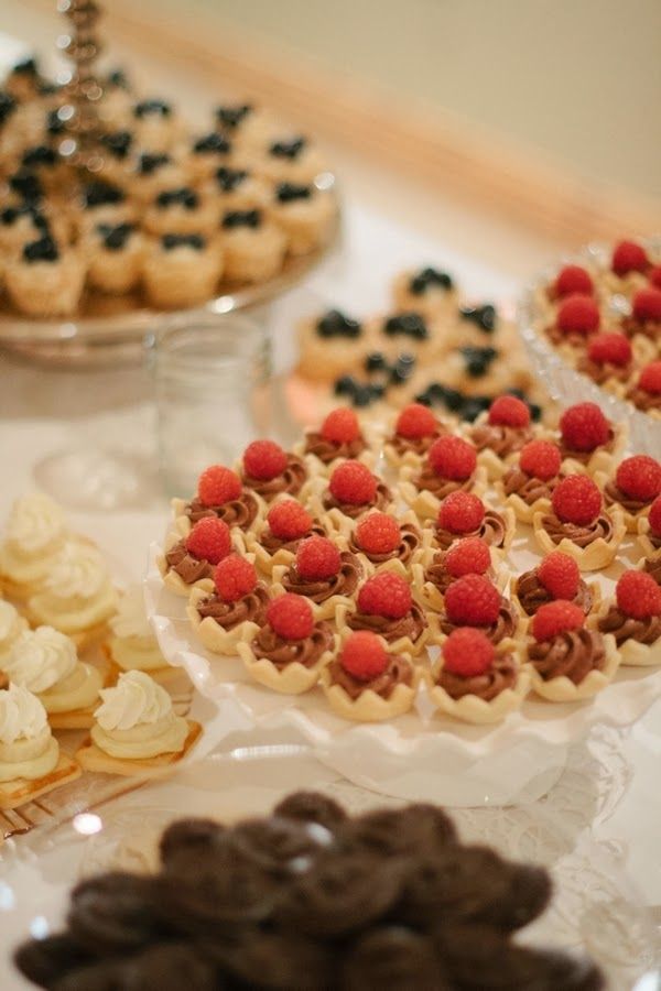 Mini tartlets with fresh berries and whipped cream or chocolate cream for a wedding