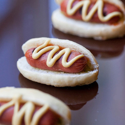 mini hotdogs will work nice for a couple that loves fast food and for the guests, too