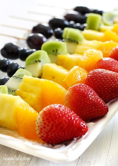 kebobs with lots of fresh fruit   strawberries, oranges, pineapples, kiwi and grapes   is always a good idea