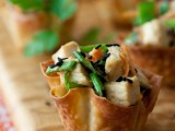 edible cups filled with salad of vegetables and chicken and sesame seeds are hearty and tasty